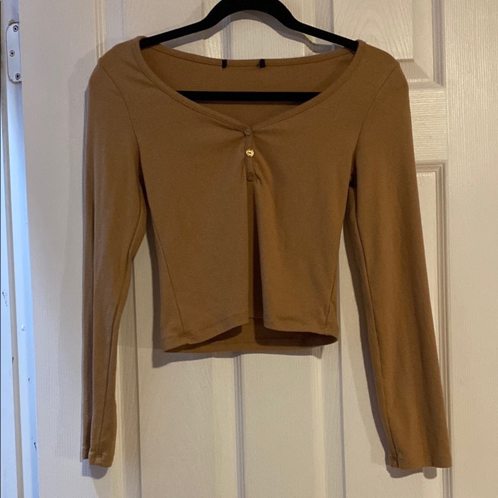 Very soft like texture. Tan long sleeve.
